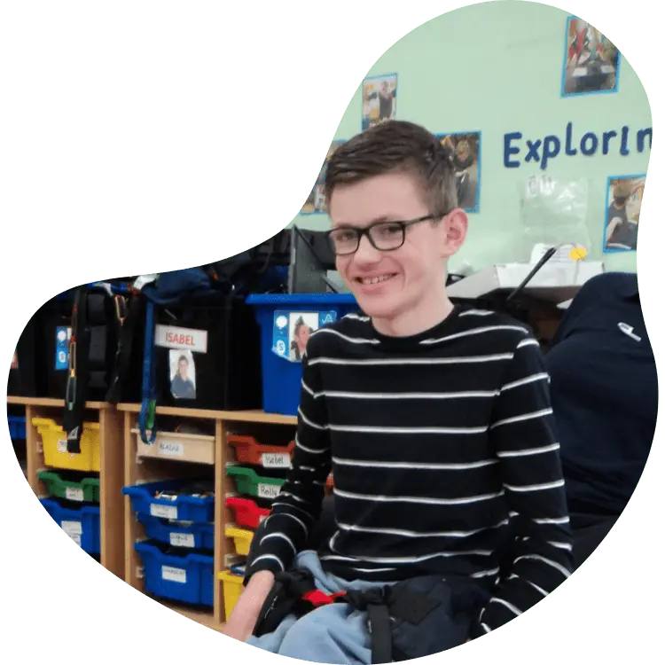 Student in classroom smiling at Ingfield Manor School